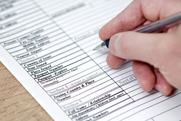 Obraz premium Filling in an application form for visa entry