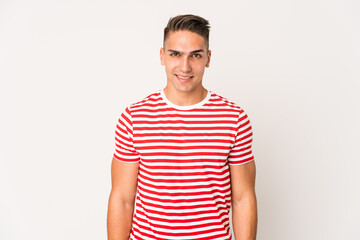 Obraz premium Young caucasian handsome man isolated laughs and closes eyes, feels relaxed and happy.