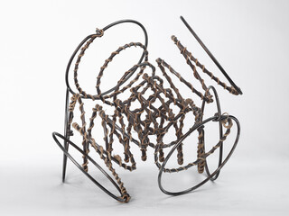 Fototapeta na wymiar Spirals - art combination steel and rope