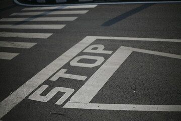 stop sign on asphalt in three-way junction road