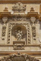 Elche Santa Maria Basilica (XVII century) at Plaza de Santa Maria is built on the foundations of old mosque. Architectural fragments of Venetian baroque facade of Santa Maria Basilica. Elche, Spain.
