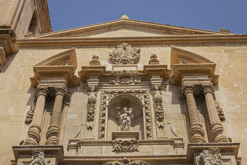 Elche Santa Maria Basilica (XVII century) at Plaza de Santa Maria is built on the foundations of old mosque. Architectural fragments of Venetian baroque facade of Santa Maria Basilica. Elche, Spain.