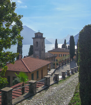pebble path descends towards the lake through an ancient village.Valsolda,.Lugano Lake, Ceresio, Italy