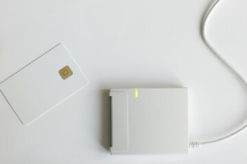A white plastic card and a personal data reader. Theft or leakage of confidential information. Mockup