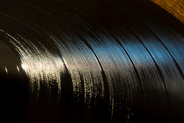 Textured background of grooves on retro vinyl record