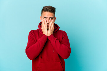 Young caucasian handsome man isolated whining and crying disconsolately.