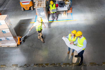 Fototapeta premium Group of warehouse workers at work, above view
