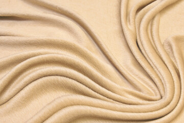 Fototapeta na wymiar Matte cream soft fabric background. Smooth elegant luxury cloth textured pattern.