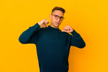 Young handsome caucasian man isolated feels proud and self confident, example to follow.