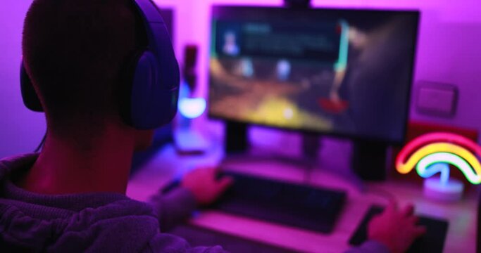 Young streamer gamer playing at strategy game in broadcast browser - Male guy having fun gaming and streaming online - New technology game trends and entertainment concept