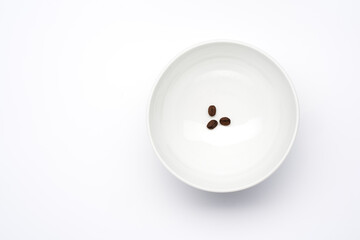 minimalism in white with a bowl and coffee beans