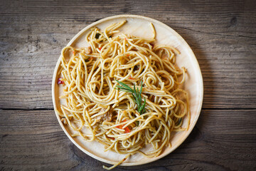 spaghetti pasta on tray wooden table background easy cooking at home, Homemade Spaghetti top view.