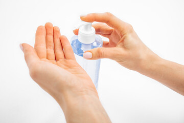 Disinfection of hands. hands applying antiseptic spray to prevent coronavirus or flu, on a white background,