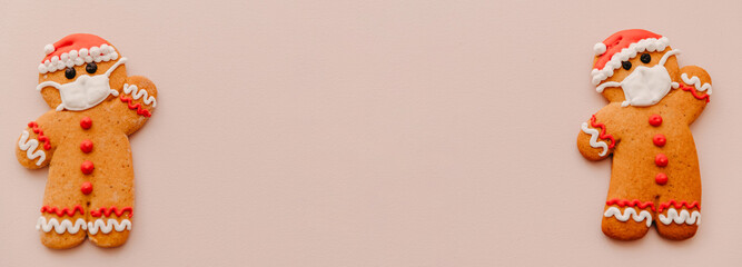 New Year and Christmas celebration in a coronavirus pandemic, conceptual background with ginger man in mask. New normal