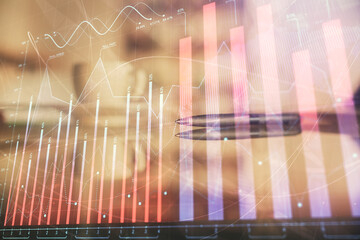 Double exposure of forex chart over coffee cup background in office. Concept of financial analysis...