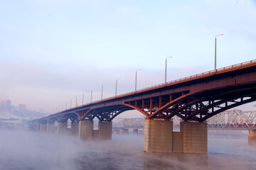 Bridge in the fog in winter, Krasnoyarsk, Yenisei river