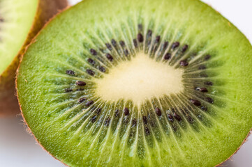 Fototapeta na wymiar slice of kiwi on kiwi background 