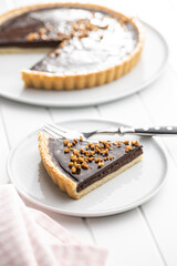 Sweet chocolate pie with crushed nuts.