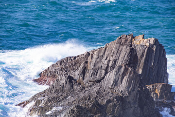 日本海の荒波と柱状節理の岩礁　島根県出雲市大社町　The raging waves of the Sea of Japan and column pillar   rocks
