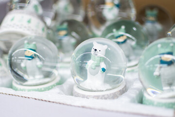 Souvenir snow globe with cute white bear