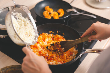 Woman cooking oriental food