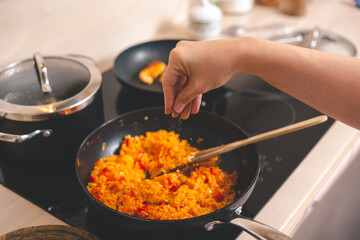 Woman seasoning food