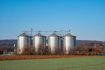 scenic landscape with four silver silos