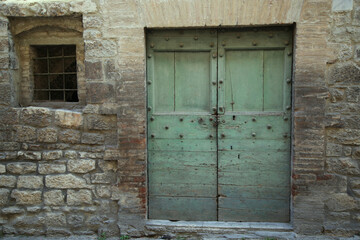 Ancient door in the city of Gubbio, Italy