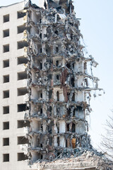 complete demolition destruction of a tall building completely ruined tall building