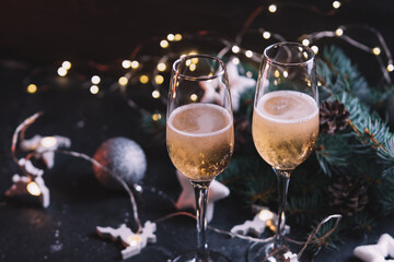 Two glasses of champagne on the holiday table with copy space