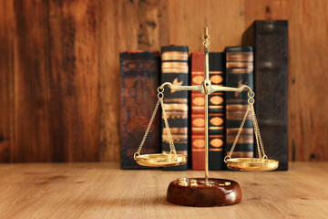 Vintage law scale over wooden table