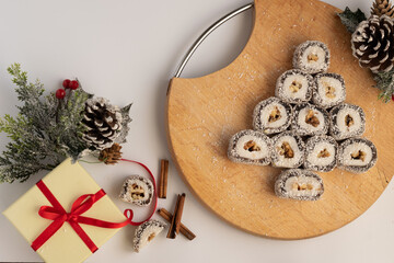 Christmas festive gift box and sweets with seasons decorations on white background