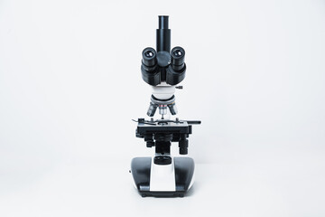 Biological microscope on a gray stone background. Scientific concept, biology. Conducting biological research, checking tissues.