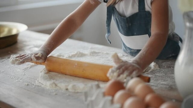 Two girls are cooking in the kitchen