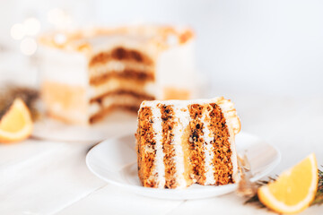 Slit cake on a white plate with a fork. Sweets for any holiday. On against a white background. Piece of cake on a white plate