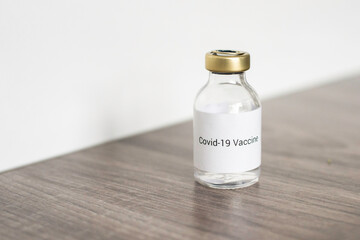 a vial with a medicine for the coronavirus, a vaccine for covid-19 with a syringe and needle