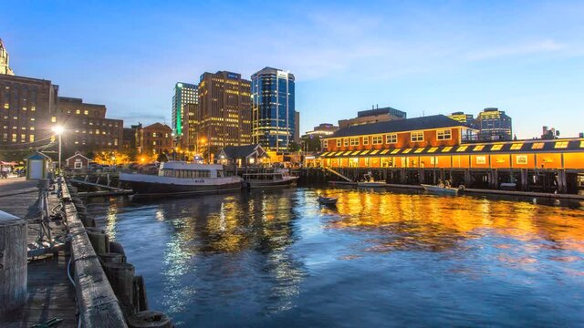 Panoramic timelapse of the old Halifax waterfront with its bustling restaurants and business & financial district in the backdrop of dynamic downtown at dusk.
