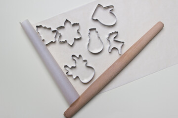 cookie forms on white colored paper backgound. top view . close up