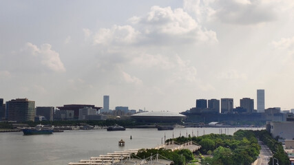 Huangpu River near Mercedes-Benz Arena (Shanghai). Houses and skyscrapers. China. Asia