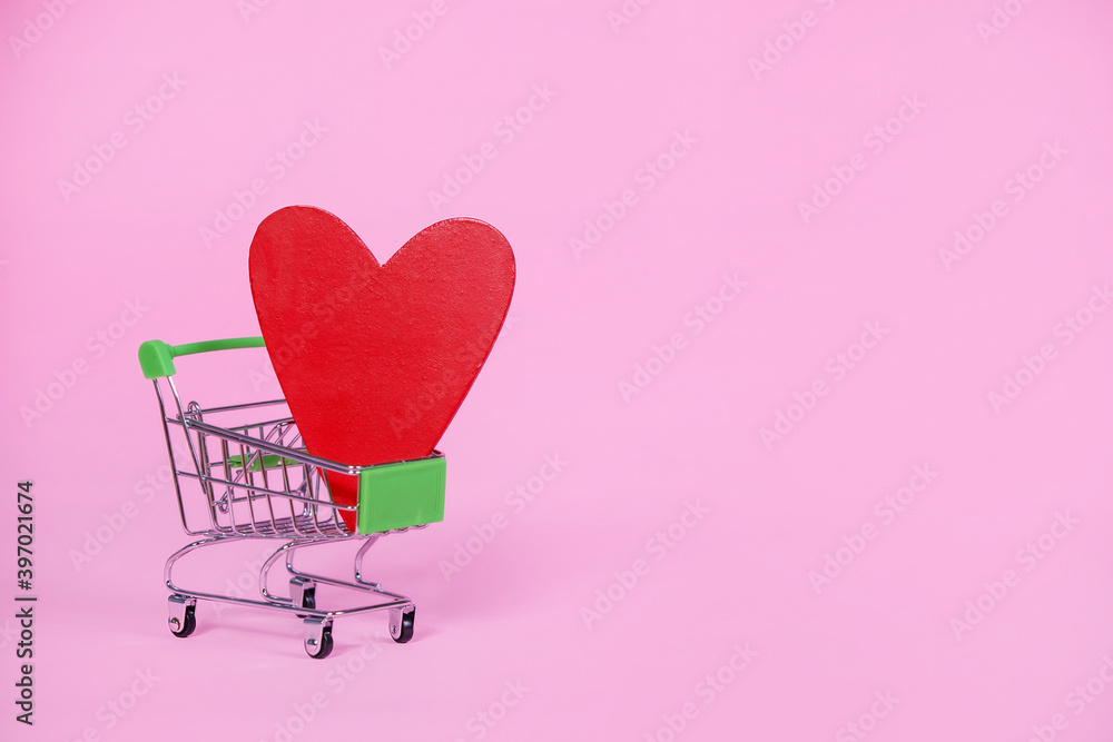 Wall mural Shopping cart with red heart