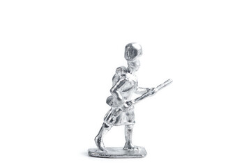 Shot of uncolored handmade tin soldier on white background
