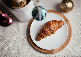 croissants on the new year's table, on a white tablecloth, vegan croissants, Breakfast at home, new year, Christmas