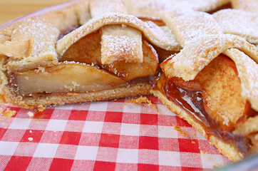 Close up of mouthwatering homemade apple pie filling's texture in the baking glass bowl