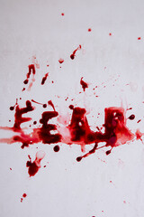 Lettering in blood, the word fear, bath on a white background