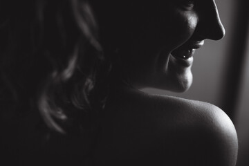 Woman smiling over shoulder