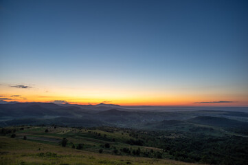 Panorama of a beautiful sunrise on the mountain in summer in Ukraine