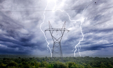 High voltage electricity pylons and transmission power lines on the blue sky background.