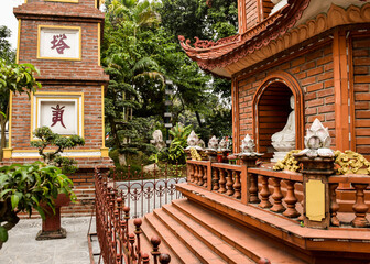 HANOI, VIETNAM - DECEMBER 30, 2019: Tran Quoc Pagoda and some other religious buildings in Hanoi.