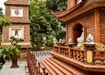 Fototapeta premium HANOI, VIETNAM - DECEMBER 30, 2019: Tran Quoc Pagoda and some other religious buildings in Hanoi.