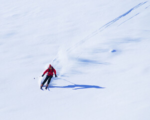 Fototapeta na wymiar Young man skiing in The Carpathians, Romania, Europe